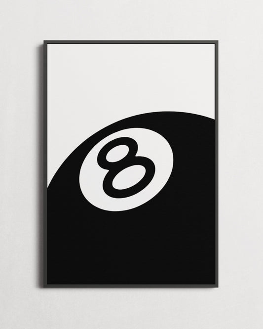 Framed poster with an eight-ball design on a white wall