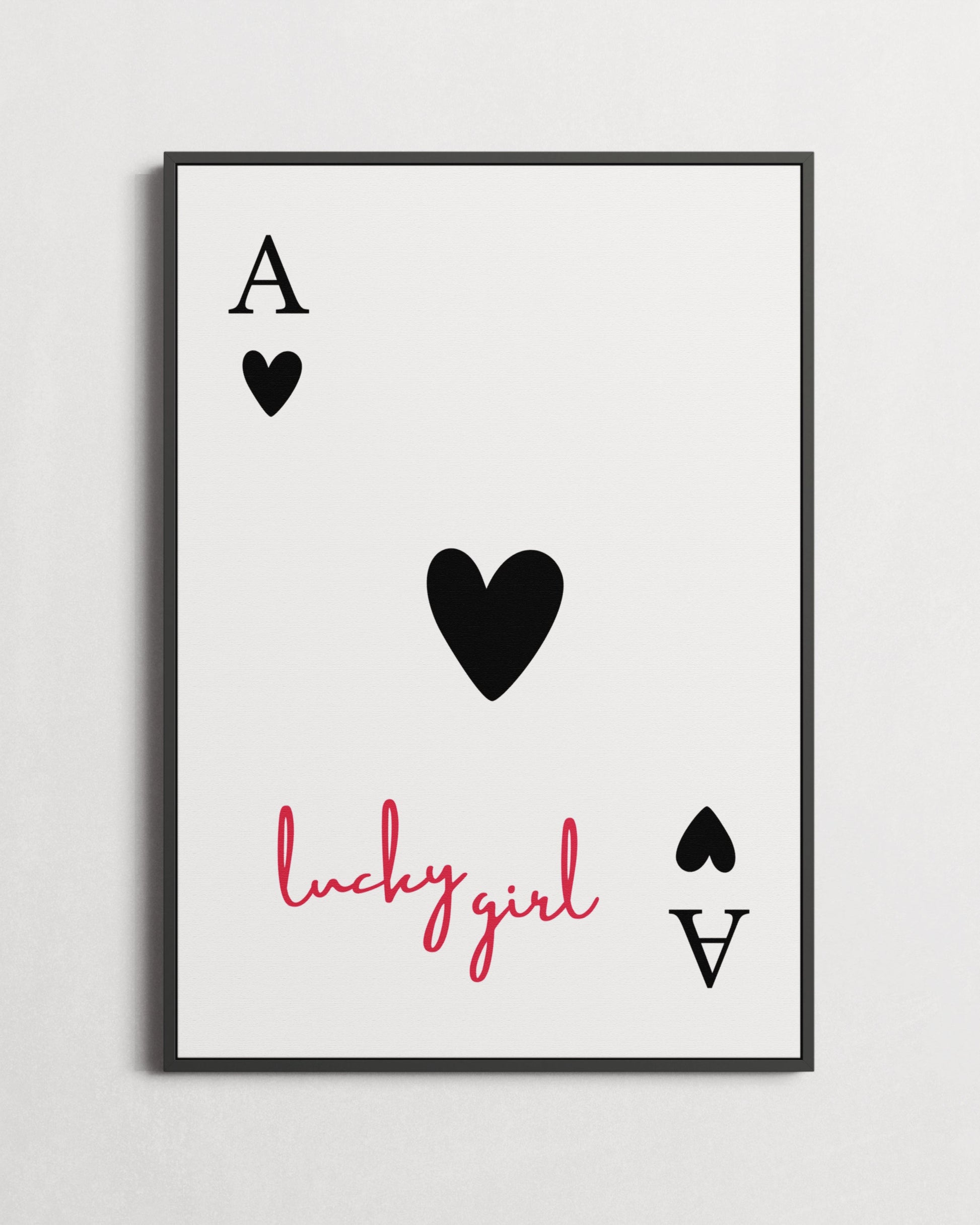 Framed artwork with playing card design and 'lucky girl' text on a light gray background